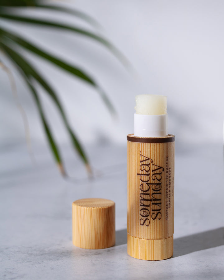 Someday Sunday Vanilla Embrace lip butter stick in its bamboo case, cap off.