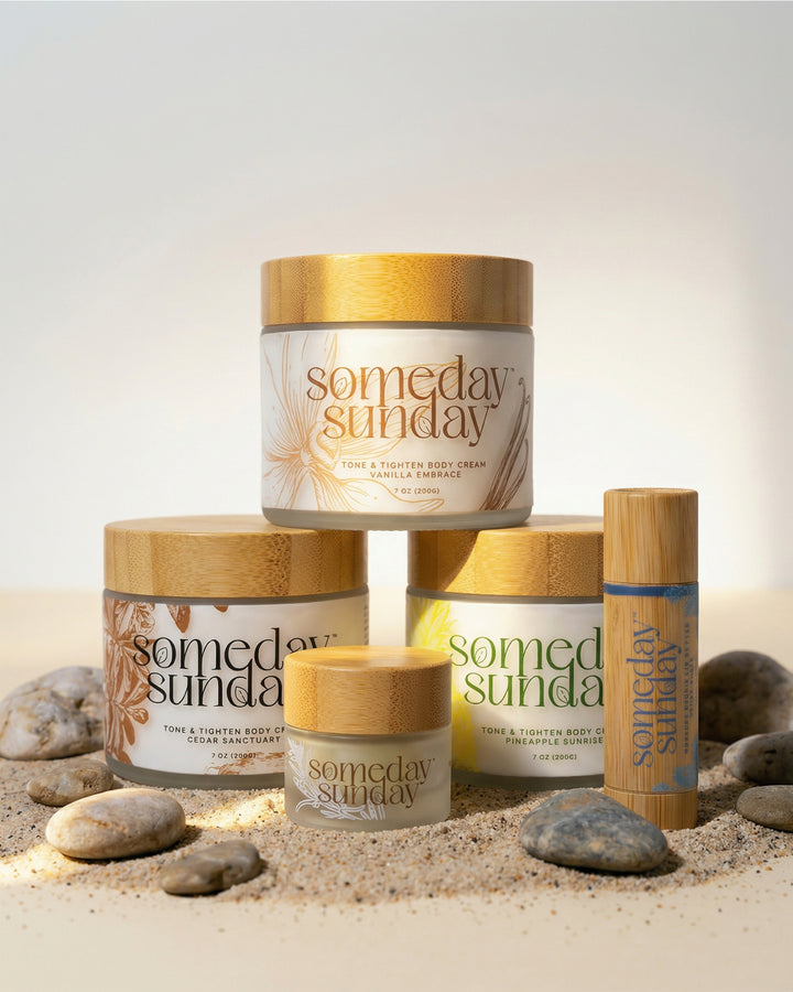 Someday Sunday body cream jars and lip butter sticks arranged on sand for a build your own duo.