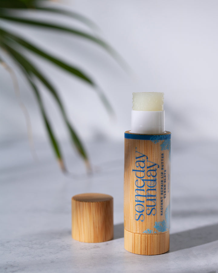 Someday Sunday Clean Slate lip butter stick, fragrance-free, in its bamboo case.