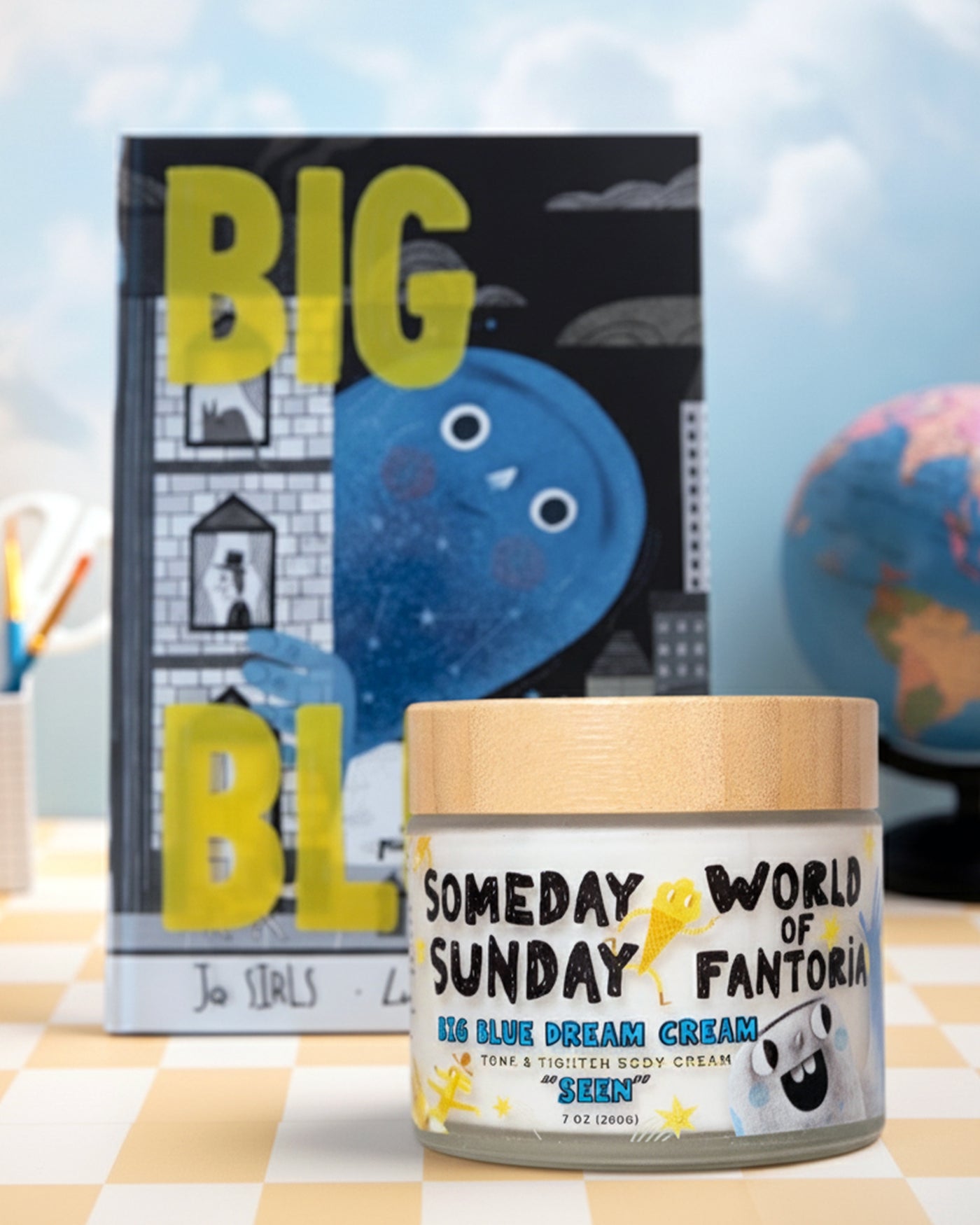 The Big Blue book beside the Someday Sunday x World of Fantoria Seen body cream jar.