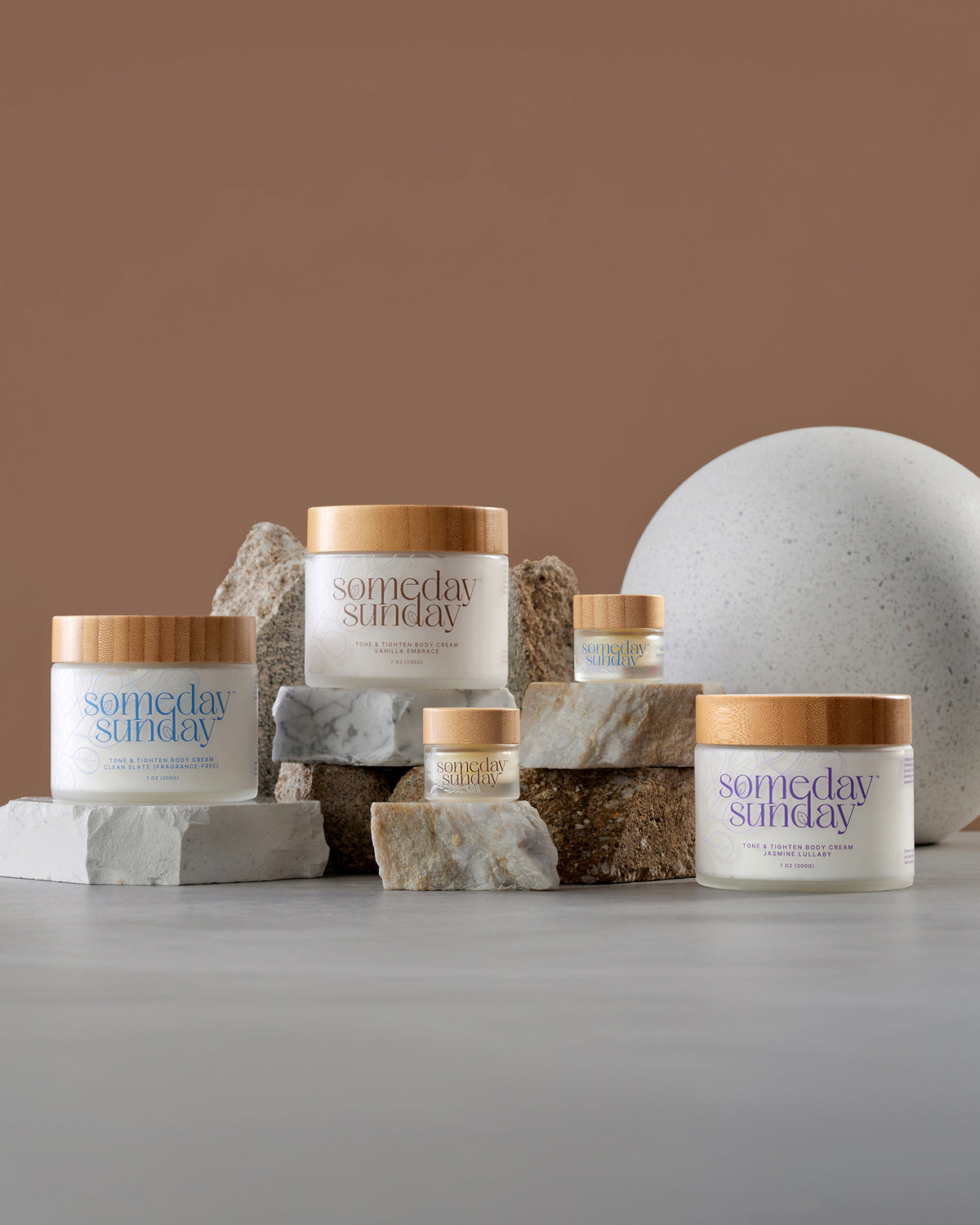 An assortment of Someday Sunday body creams and lip butters for a build your own trio.